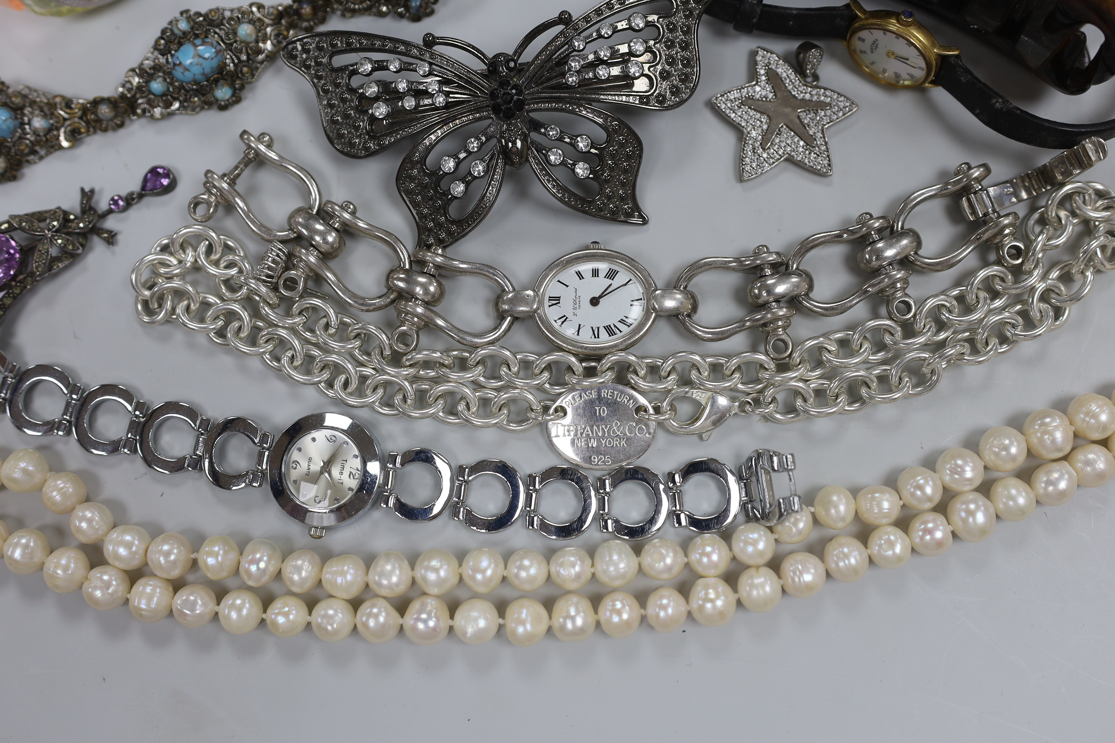 Four assorted 9ct gold and gem set rings, gross weight 6.3 grams, a 925 and rose quartz bracelet, a silver bracelet watch, a silver horseshoe and riding crop brooch and other jewellery including costume.